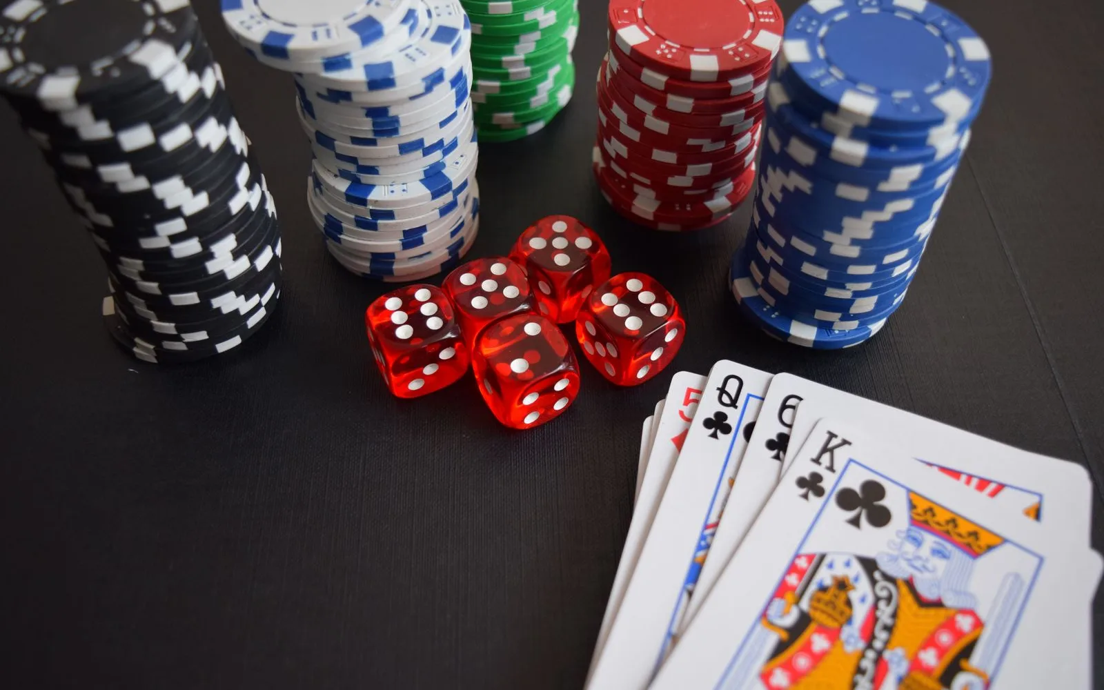 Generic playing cards, dice and chips used to illustrate game categories