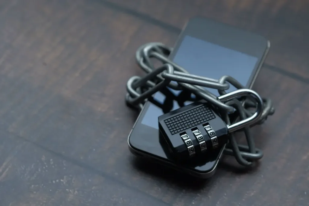 Smartphone secured with a lock illustrating mobile-app safety checks