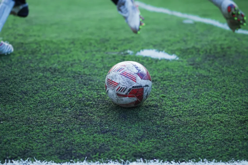 Football on a grass field illustrating sports-category information